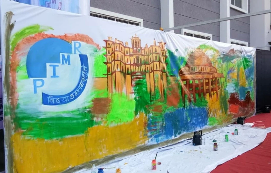 A colourful PIMR mural at a campus event